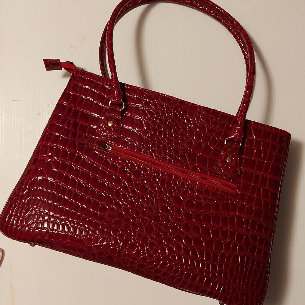 Dark red alligator embossed shoulder bag.